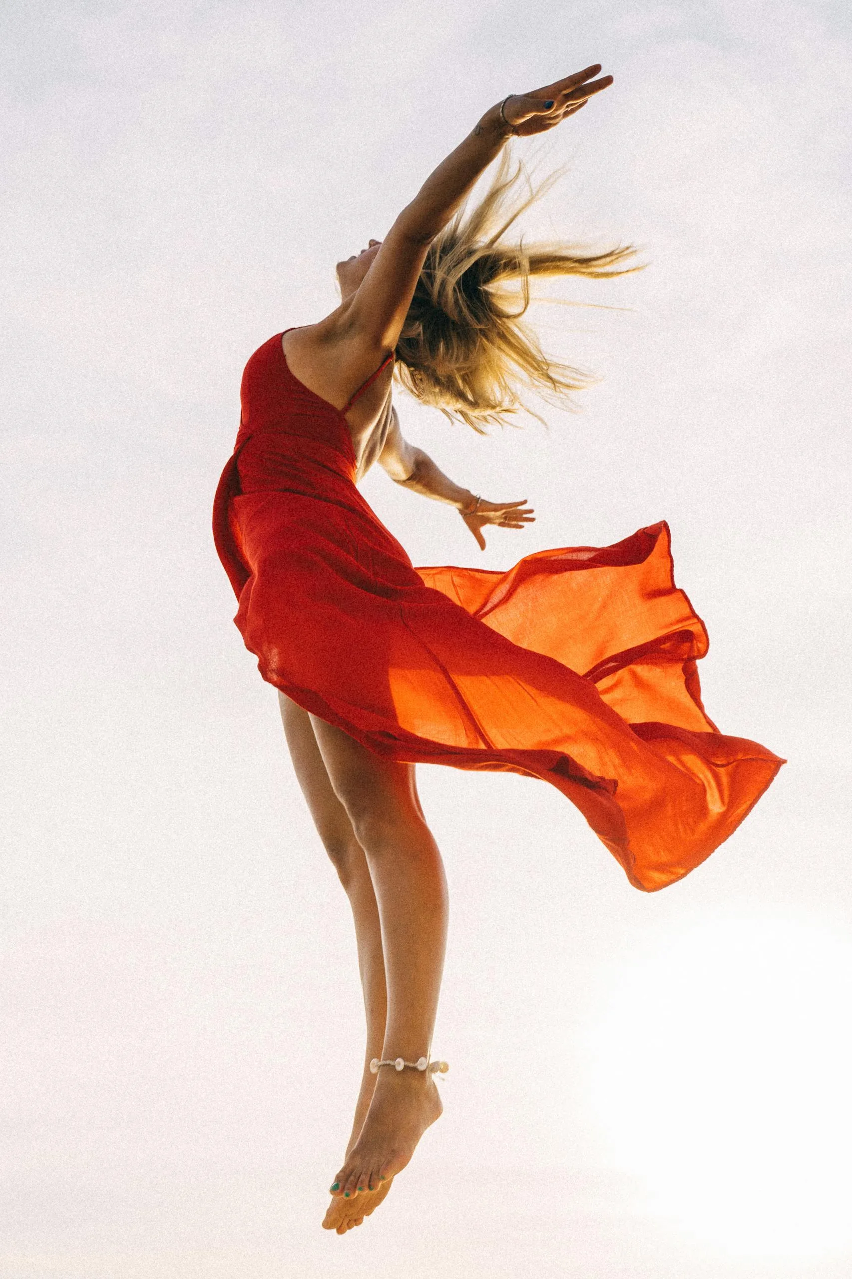 Jumping Woman in Red Dress